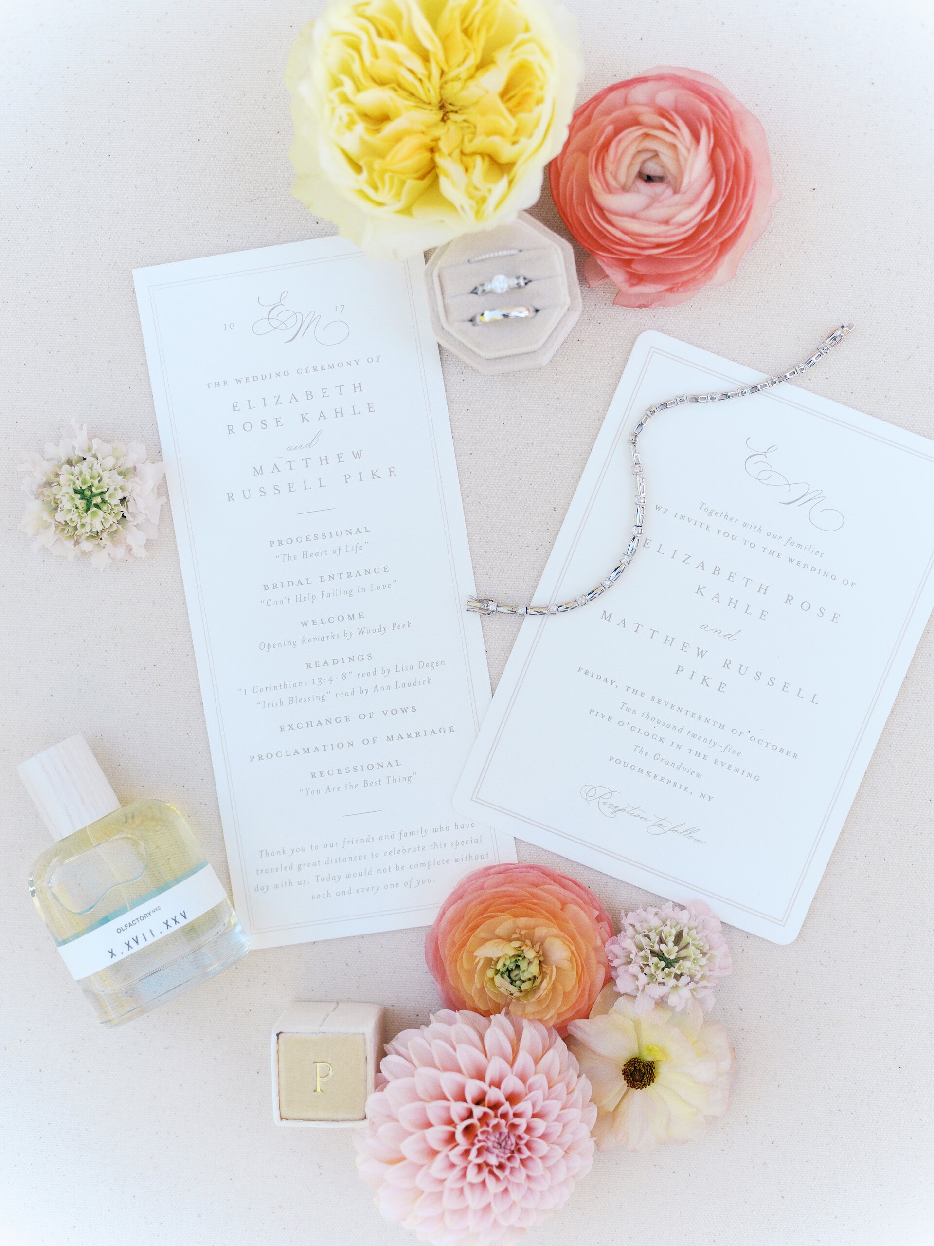 Wedding invitation suite flat lay with florals and ceremony details for Elizabeth and Matt's wedding at The Grandview Poughkeepsie NY